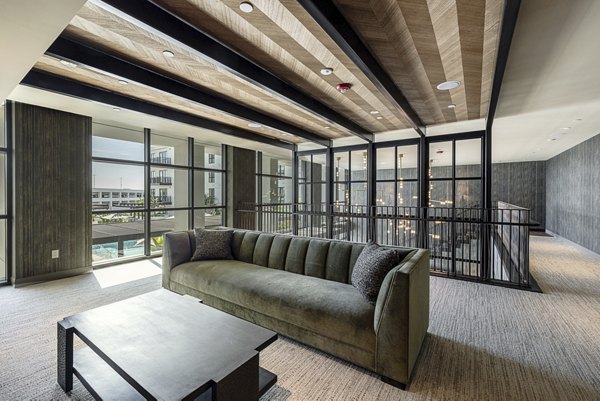 Clubhouse featuring modern decor and comfortable seating at Hollywood Park Apartments, a luxurious living community