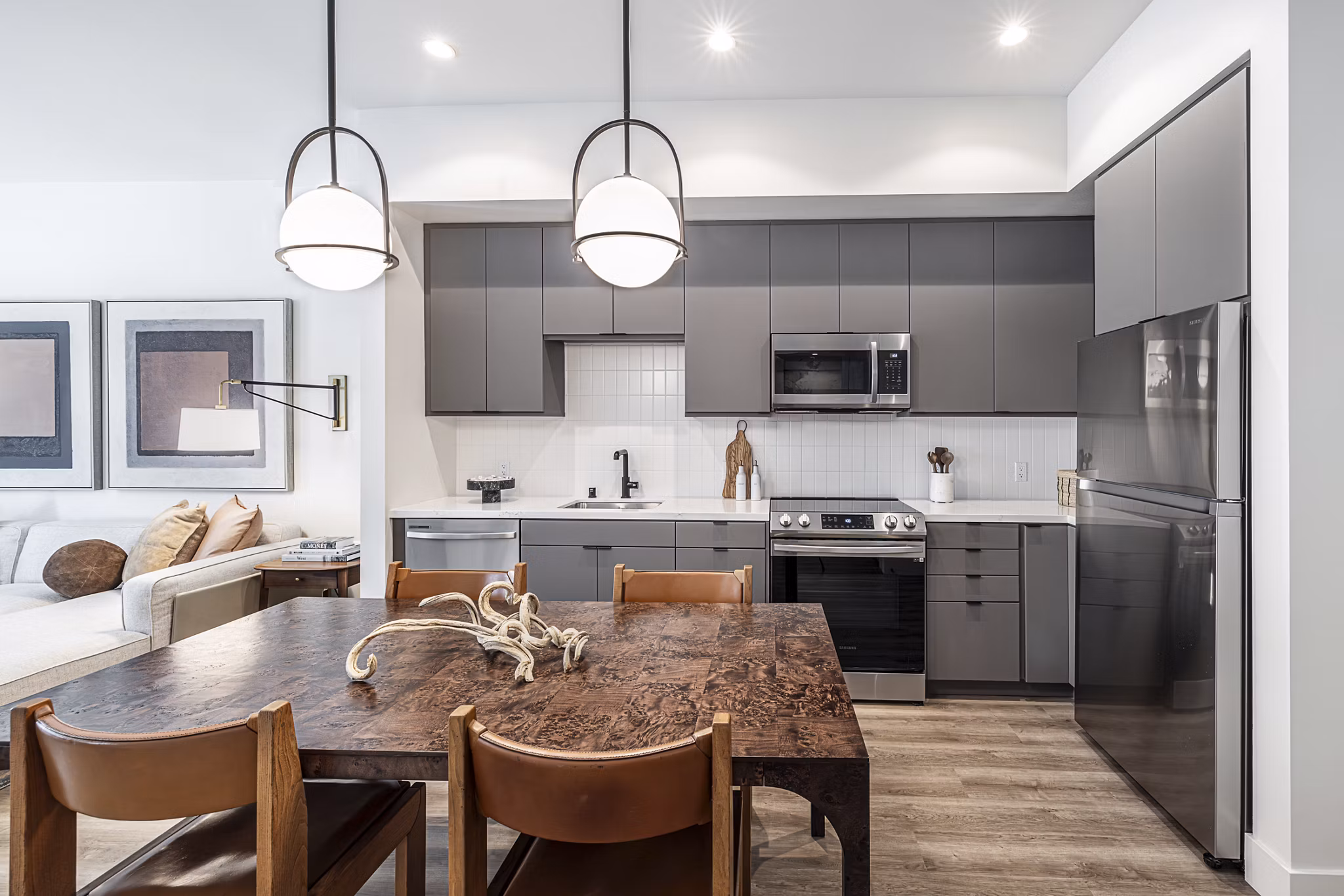 Dining area with modern furnishings at Hollywood Park Apartments featuring stylish lighting and open layout