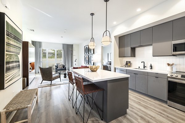 Modern kitchen with stainless steel appliances at Hollywood Park Apartments
