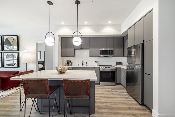 Modern kitchen with stainless steel appliances at Hollywood Park Apartments