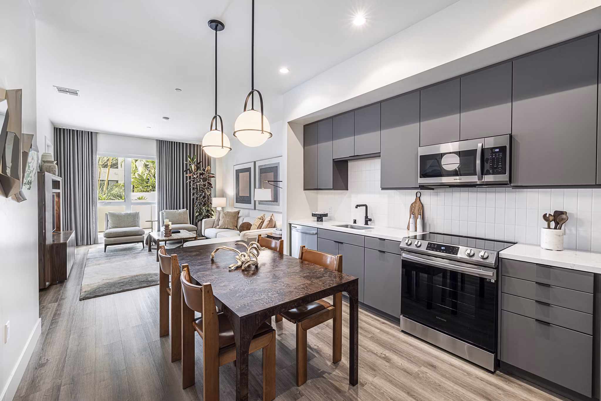 Modern kitchen with stainless steel appliances and island counter at Hollywood Park Apartments