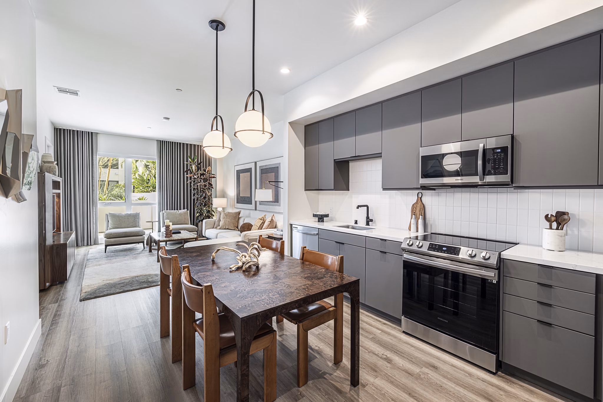 Modern kitchen with stainless steel appliances and island counter at Hollywood Park Apartments