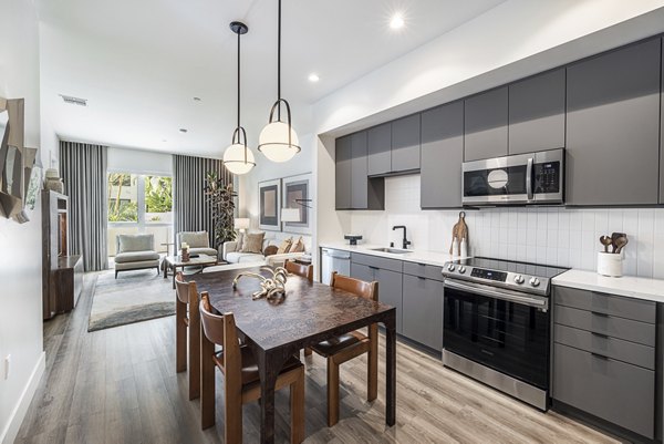 Modern kitchen with stainless steel appliances and island counter at Hollywood Park Apartments