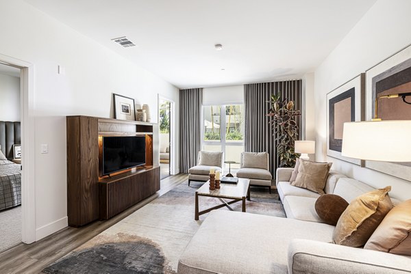 Spacious living room with modern decor at Hollywood Park Apartments
