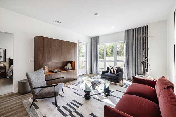Hollywood Park Apartments: Modern living room with stylish decor and natural light