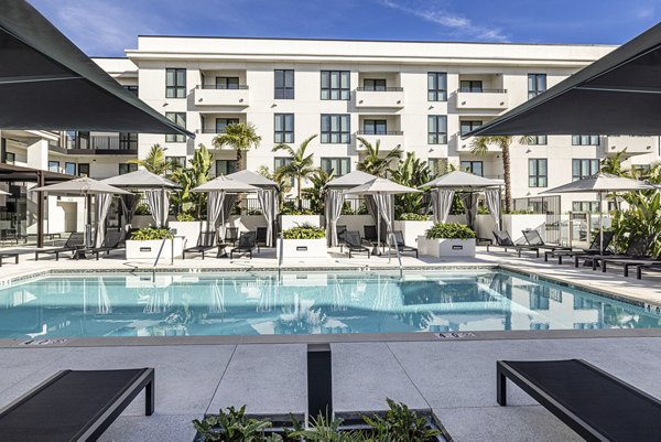 Resort-style pool with lounge seating at Hollywood Park Apartments, luxurious living in the heart of a vibrant community