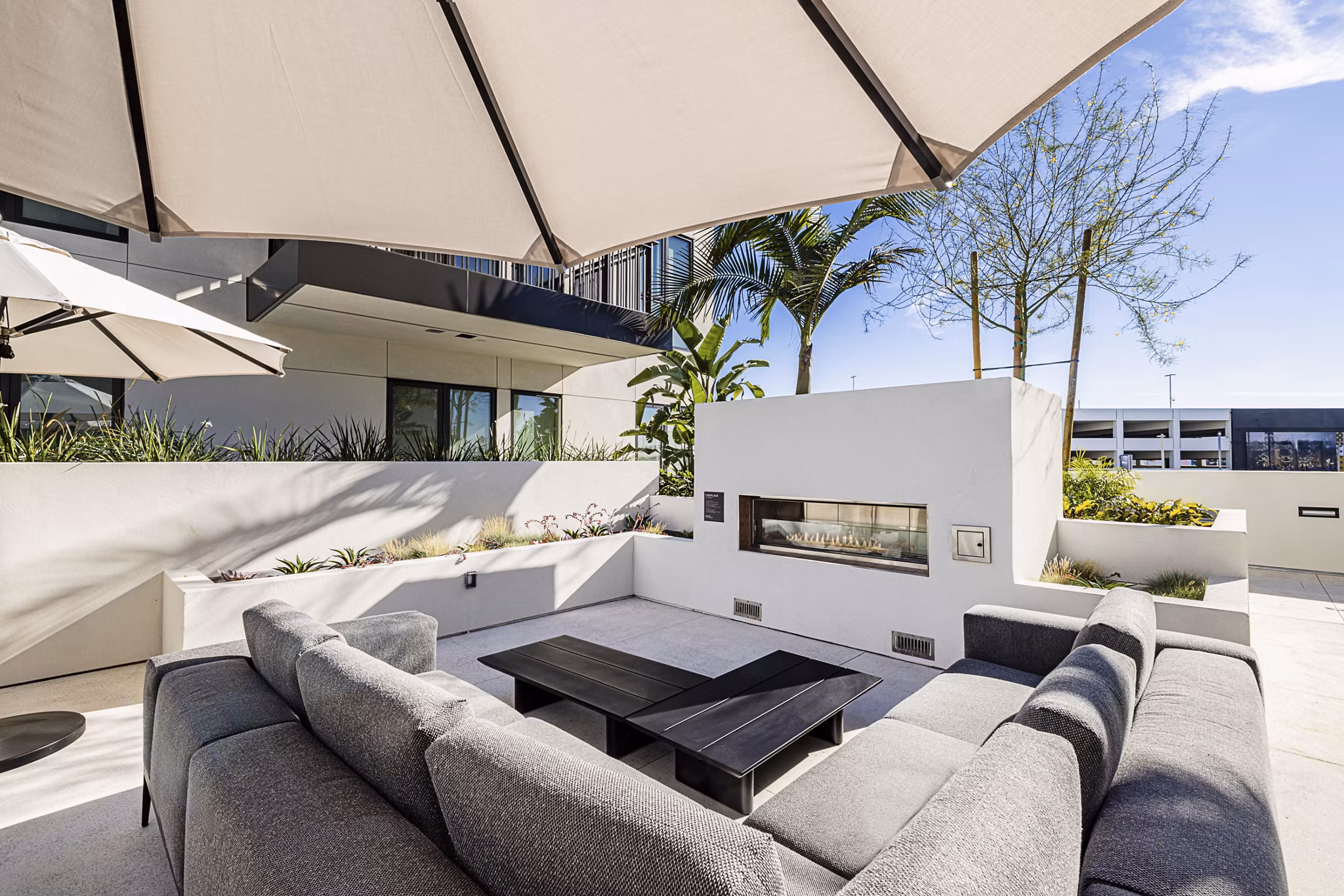 Outdoor fire pit area at Hollywood Park Apartments, a luxury community by Greystar