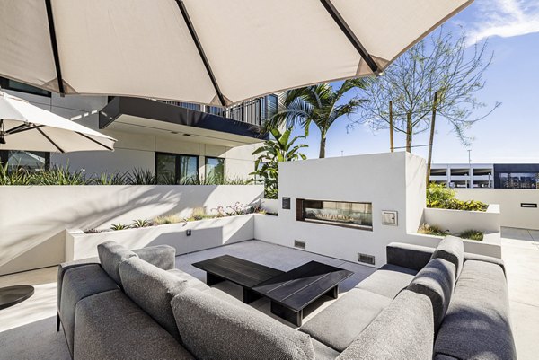 Outdoor fire pit area at Hollywood Park Apartments, a luxury community by Greystar