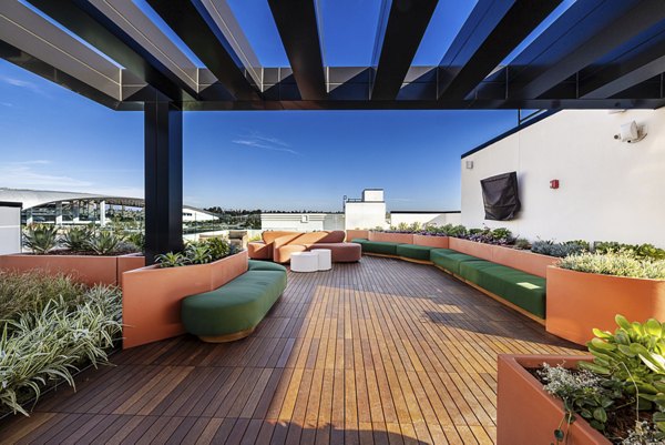 Scenic rooftop deck with lush greenery at Hollywood Park Apartments offers a tranquil escape in the heart of the city