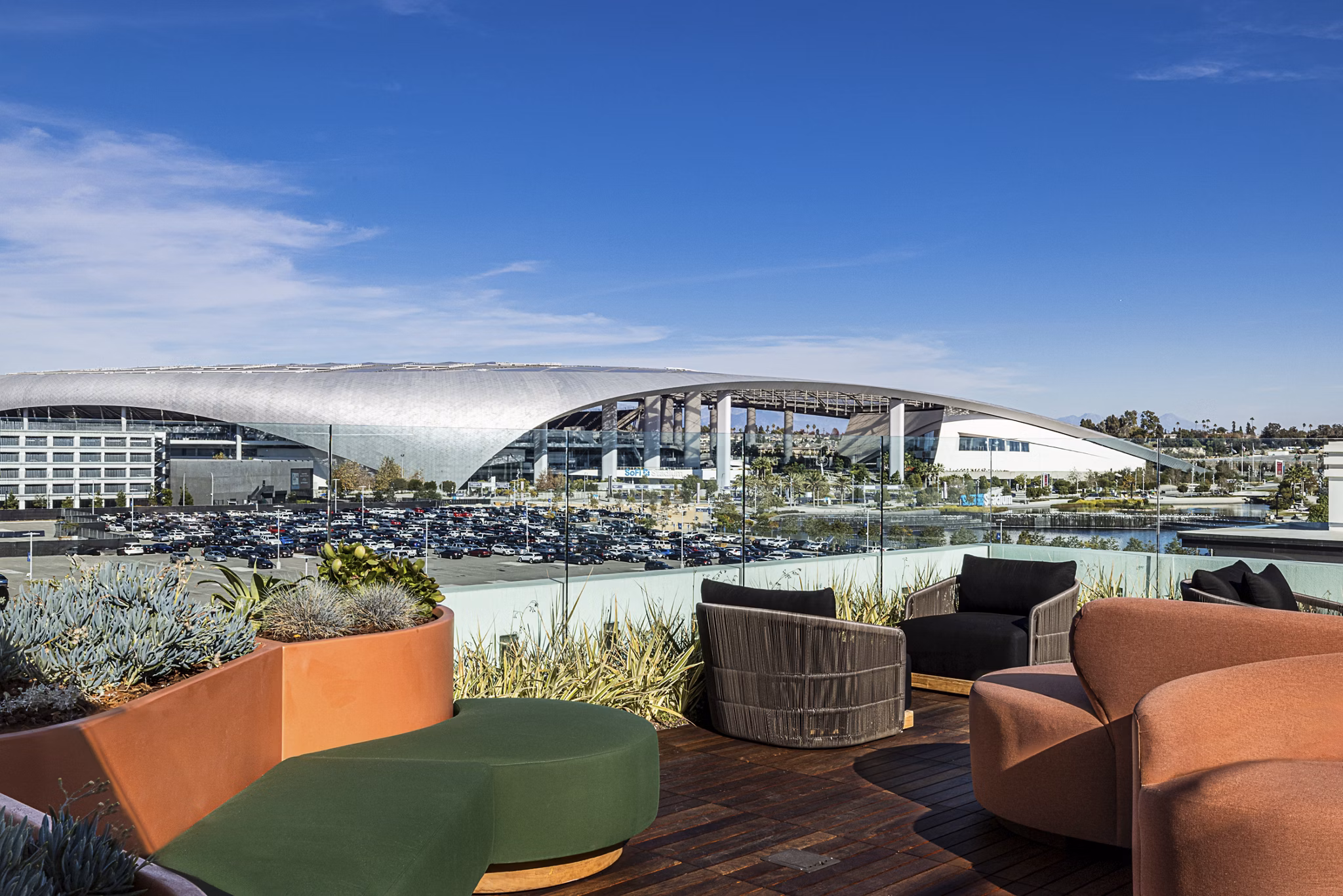 Spacious rooftop deck with outdoor seating at Hollywood Park Apartments offering panoramic city views