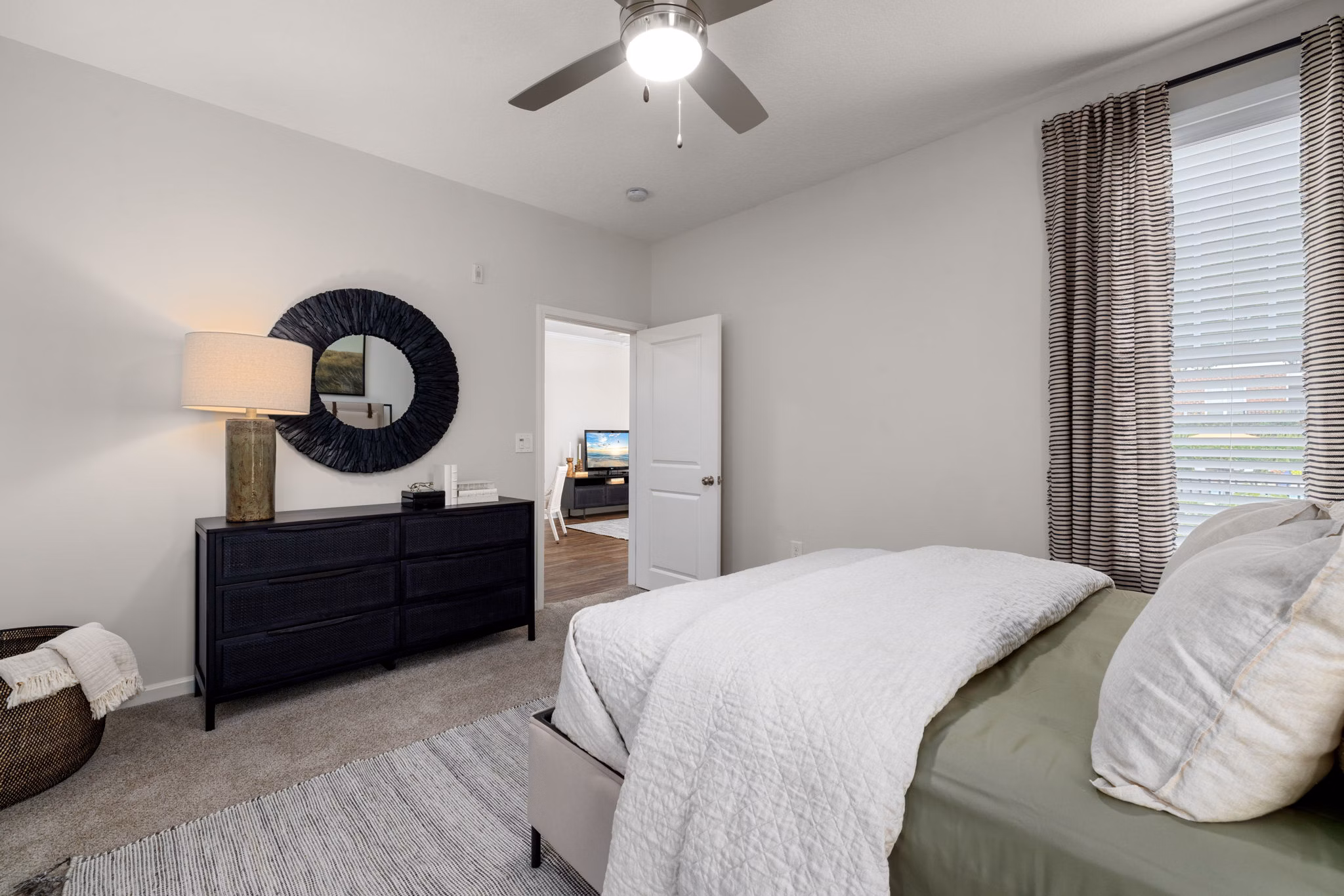 Spacious bedroom with stylish decor at Legacy at Wakefield Apartments luxuriously managed by Greystar, ideal for modern living
