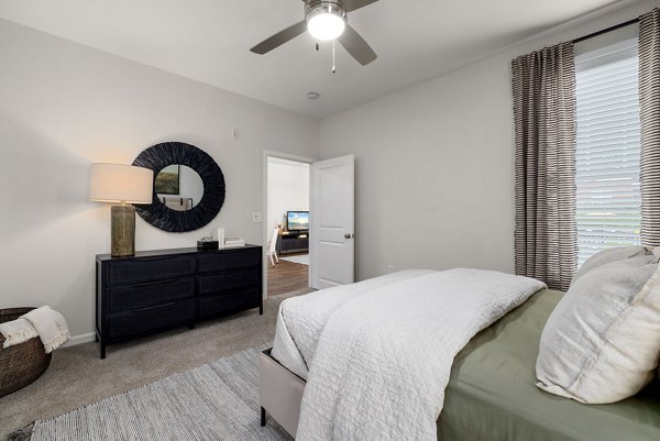 Spacious bedroom with stylish decor at Legacy at Wakefield Apartments luxuriously managed by Greystar, ideal for modern living