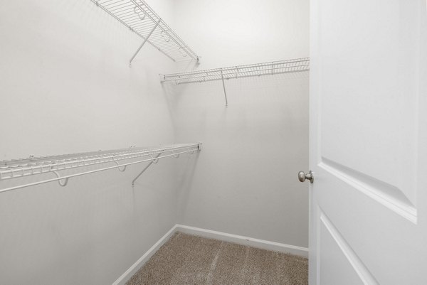 Spacious closet with ample shelving and storage space in Legacy at Wakefield Apartments' luxurious bedroom