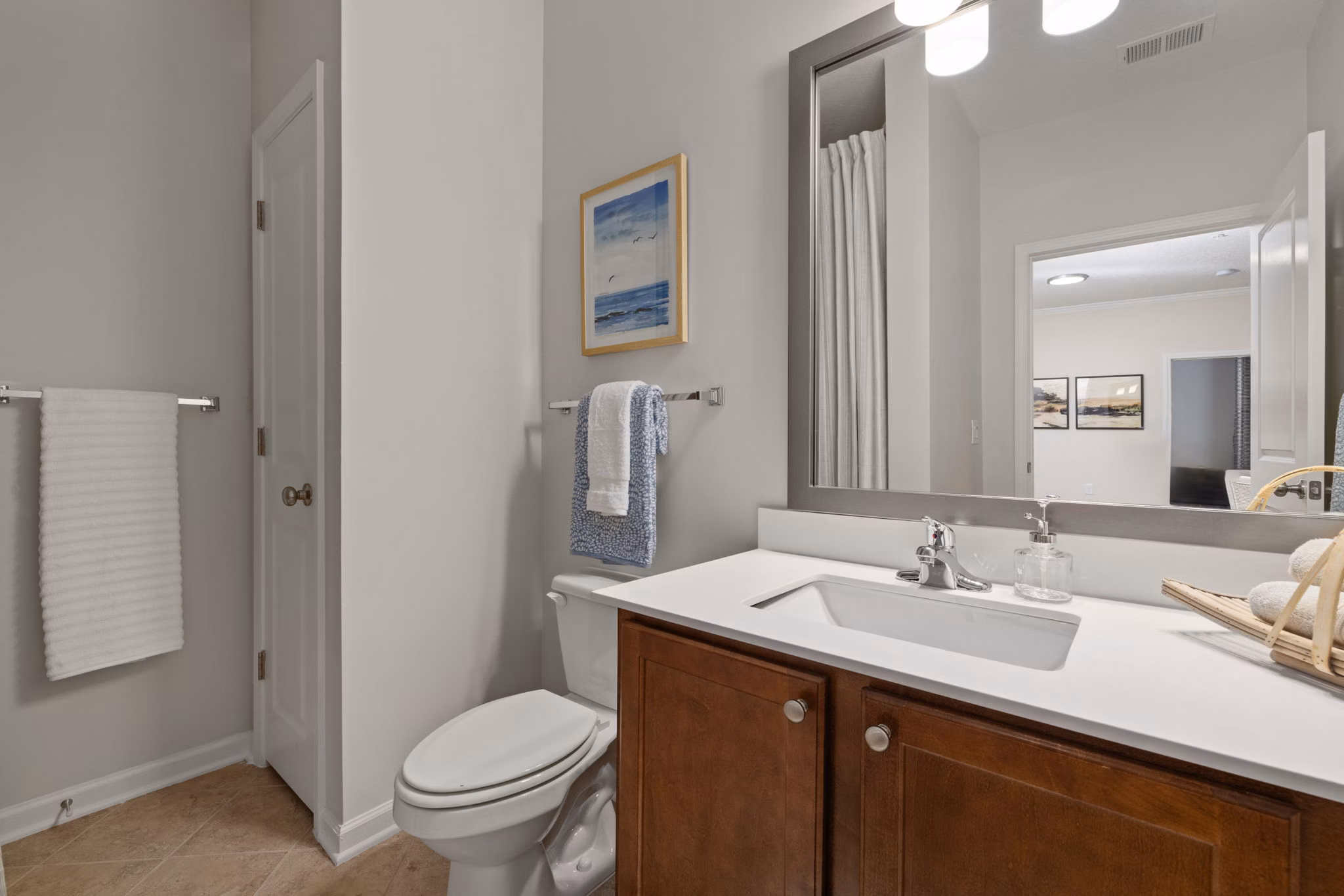 Modern bathroom with dual sinks and elegant fixtures at Legacy at Wakefield Apartments