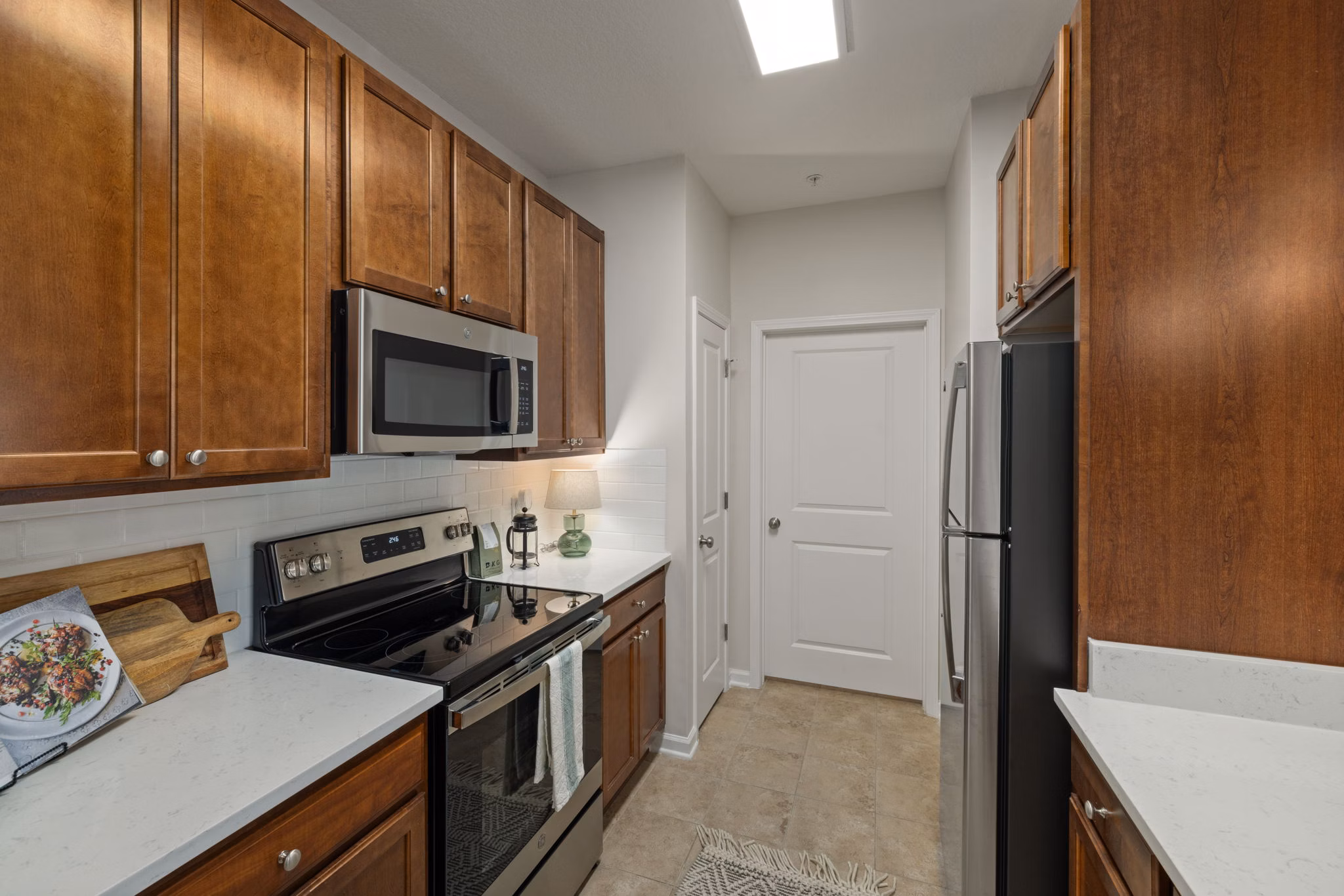 Modern kitchen with stainless steel appliances and granite countertops at Legacy at Wakefield Apartments