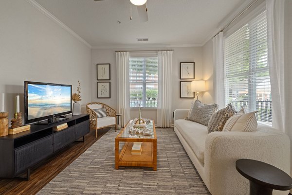 Spacious living room with modern furnishings in Legacy at Wakefield Apartments
