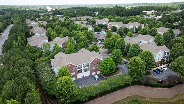Legacy at Wakefield: Elegant view of luxury apartments with landscaped surroundings