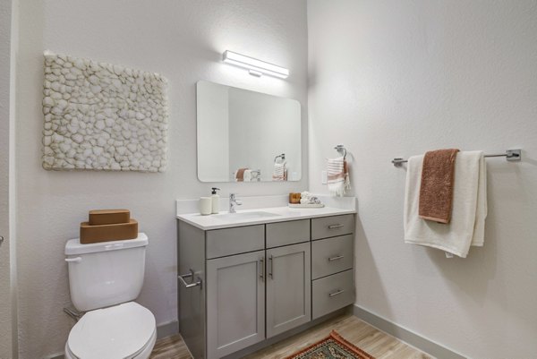 Modern bathroom featuring sleek fixtures and elegant design at NOMA Apartments, luxury living in a prime location