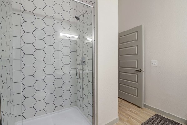 Modern bathroom with sleek fixtures at NOMA Apartments, offering luxurious living spaces in a prime urban location