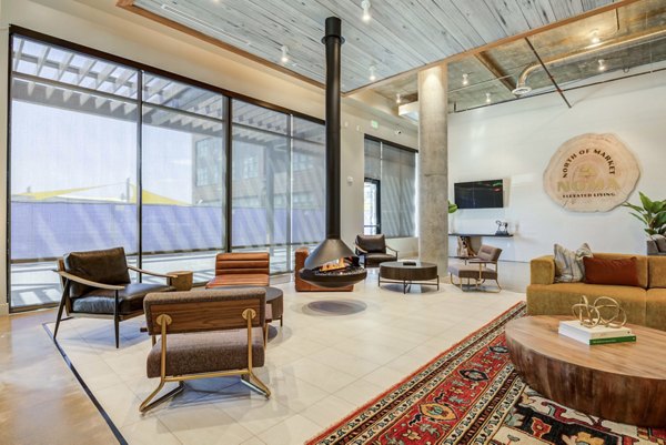 Clubhouse with modern design and spacious seating at NOMA Apartments in Greystar luxury community