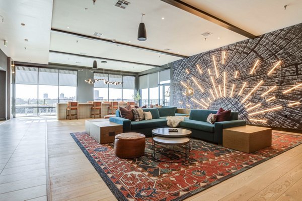 Stylish clubhouse with modern seating and decor at NOMA Apartments in a luxury setting
