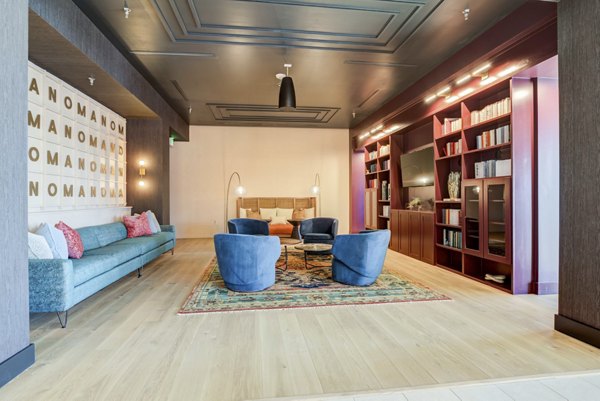Modern clubhouse with stylish seating and open spaces at NOMA Apartments, ideal for social gatherings and events
