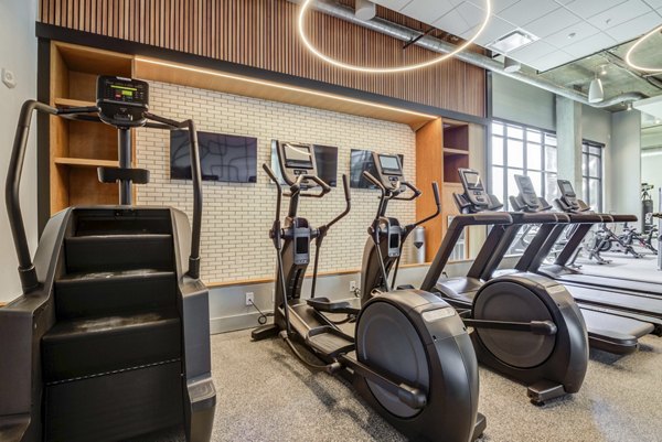 State-of-the-art fitness center with modern equipment at NOMA Apartments, luxury living by Greystar