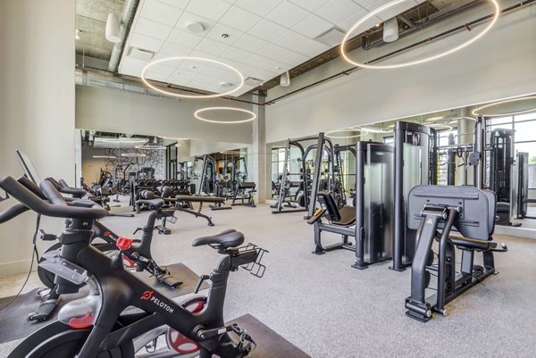 Modern fitness center with state-of-the-art equipment at NOMA Apartments