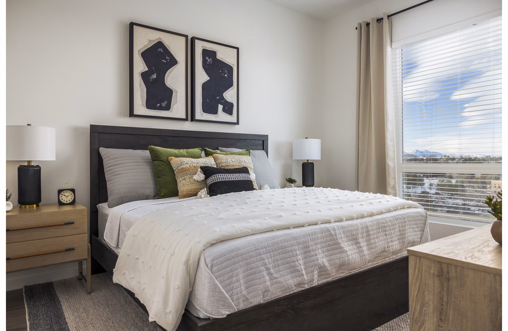 Luxury bedroom with modern decor at Braxton Apartments