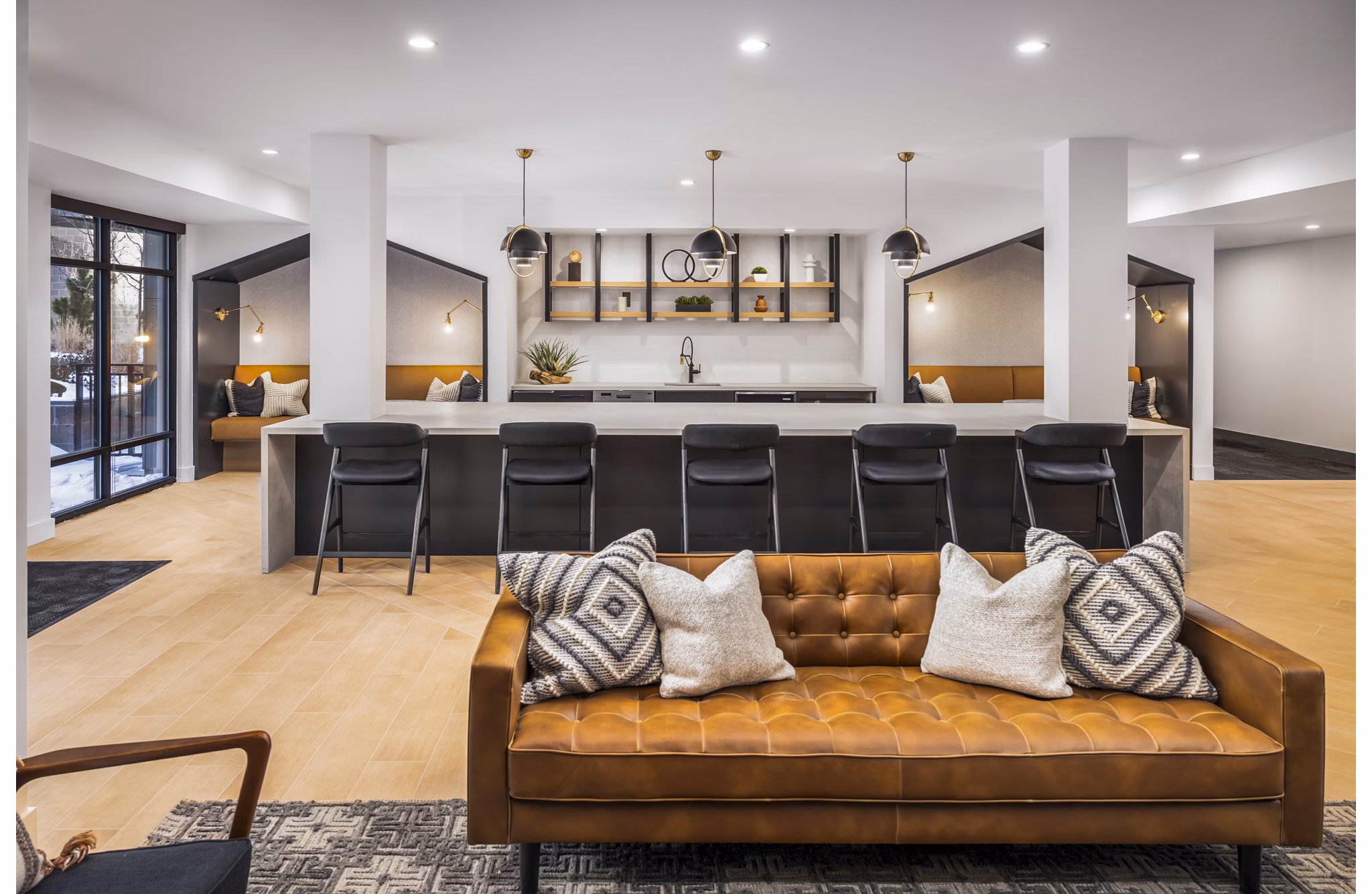 Clubhouse kitchen with modern appliances and sleek design at Braxton Apartments, luxury community by Greystar