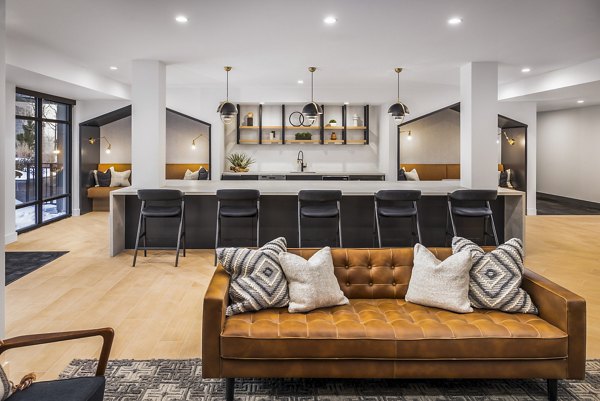 Clubhouse kitchen with modern appliances and sleek design at Braxton Apartments, luxury community by Greystar