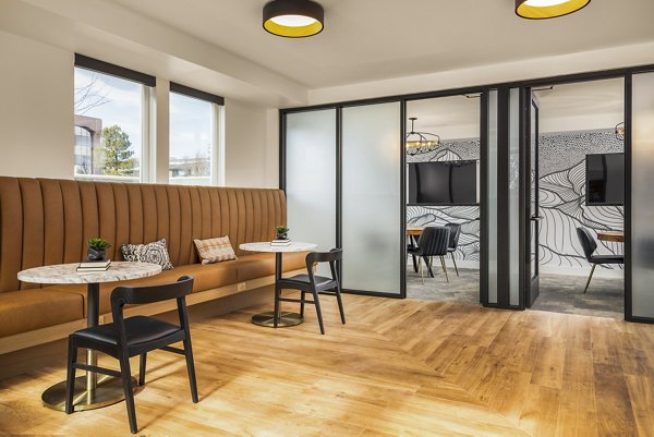Braxton Apartments: Modern clubhouse business center with collaborative workspaces in a luxury setting