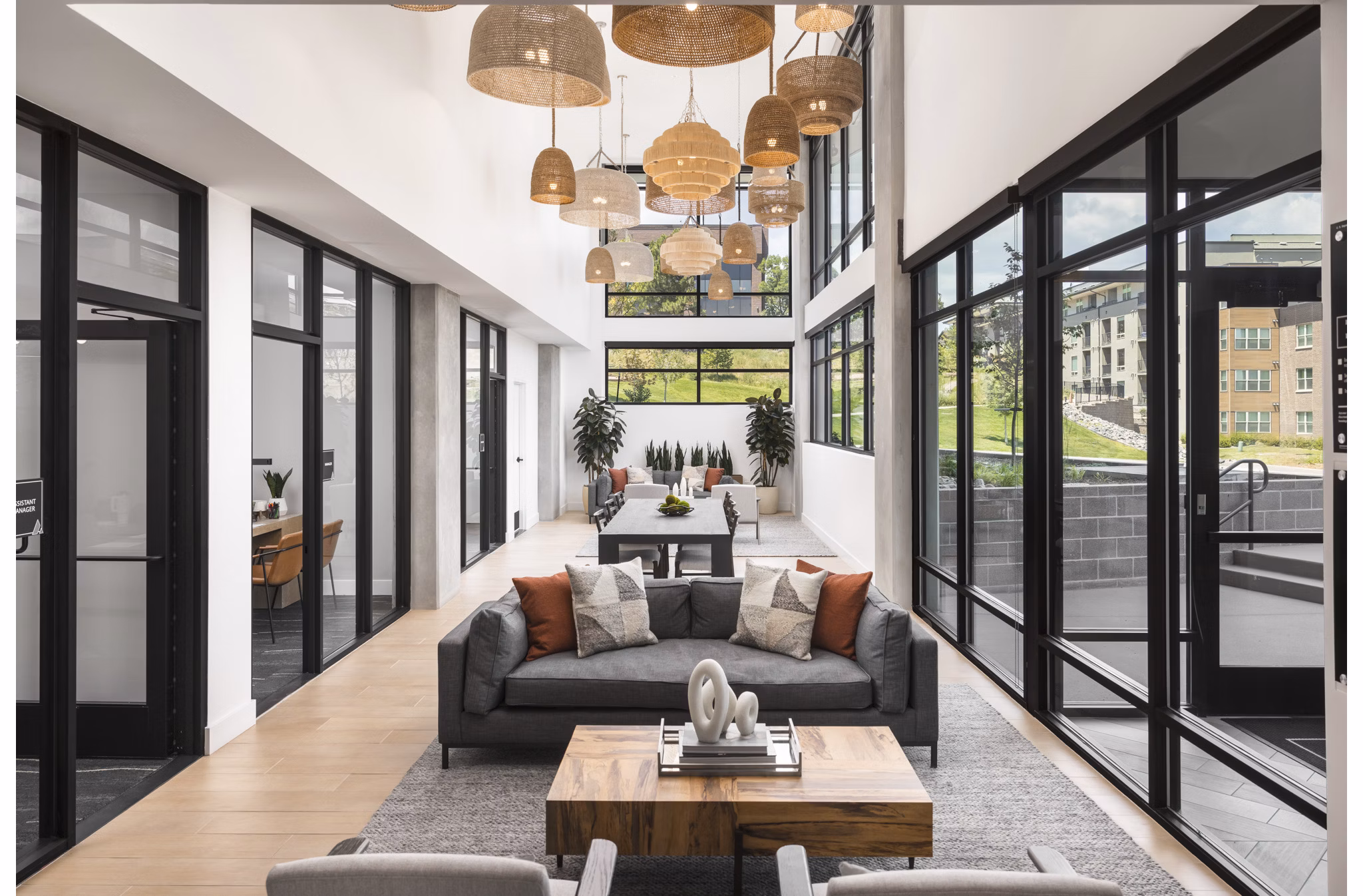 Stylish clubhouse with modern furniture and vibrant dÃ©cor at Braxton Apartments