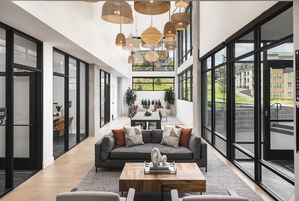 Stylish clubhouse with modern furniture and vibrant dÃ©cor at Braxton Apartments