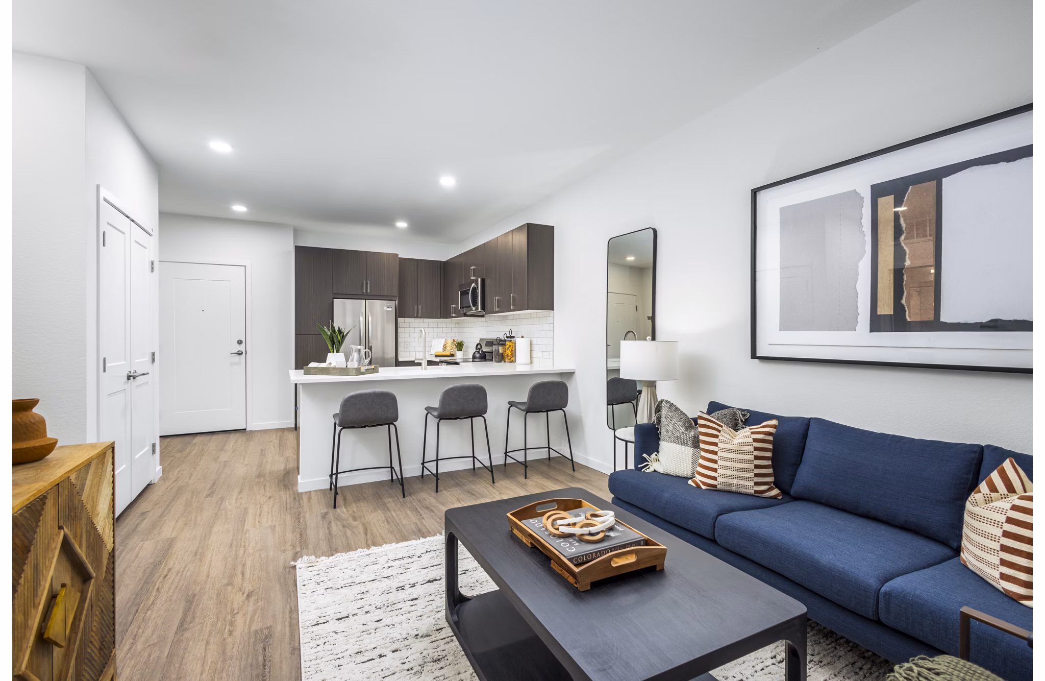 Spacious living room with modern decor at Braxton Apartments, featuring luxury amenities for a comfortable lifestyle