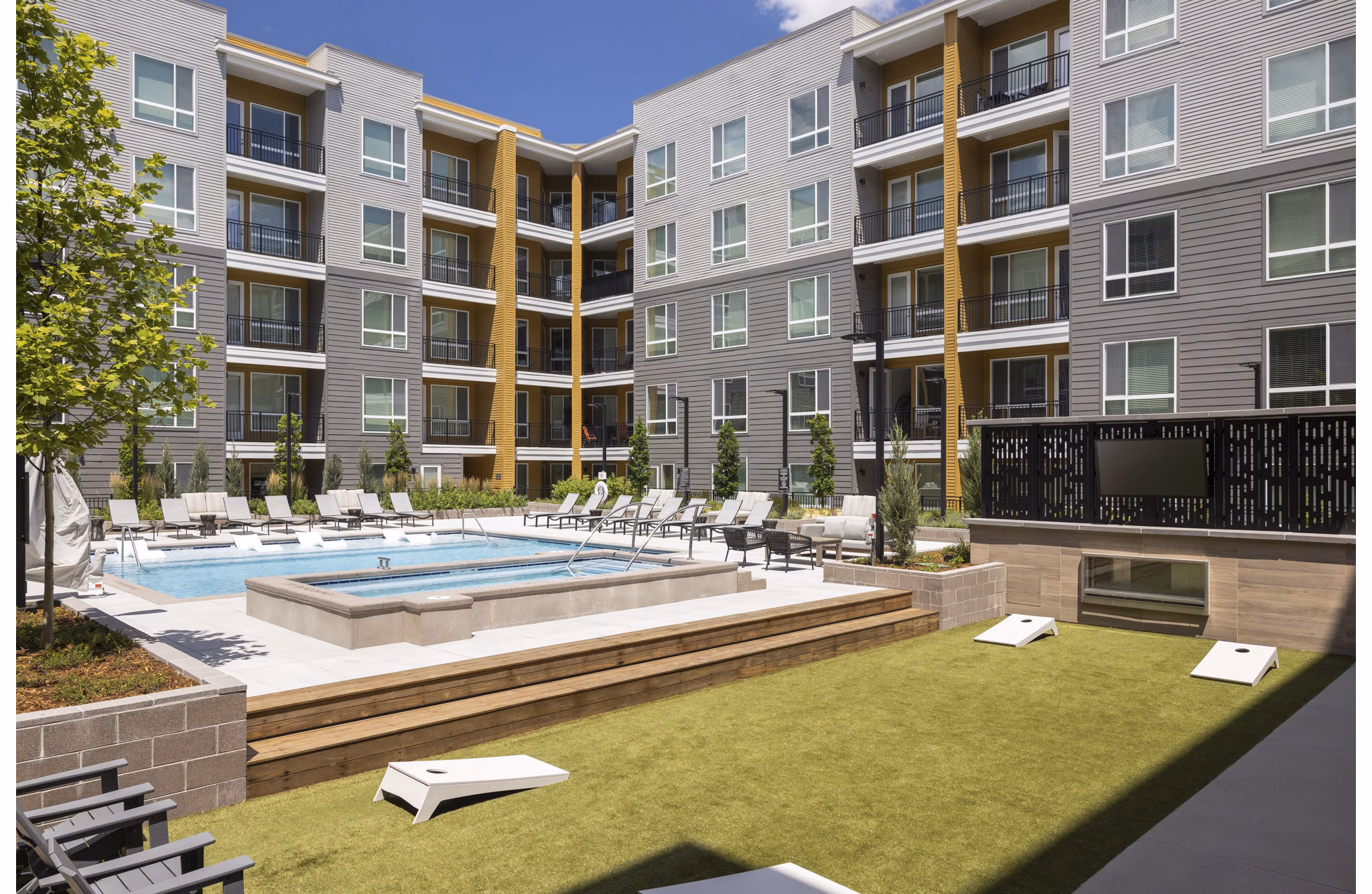 Luxurious pool and recreational area at Braxton Apartments offering leisure and relaxation for residents