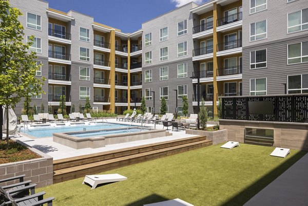 Luxurious pool and recreational area at Braxton Apartments offering leisure and relaxation for residents