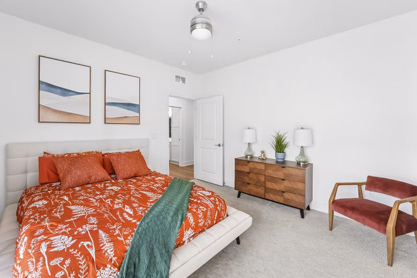 Cozy bedroom with elegant decor at Capriana Apartments offering luxury living