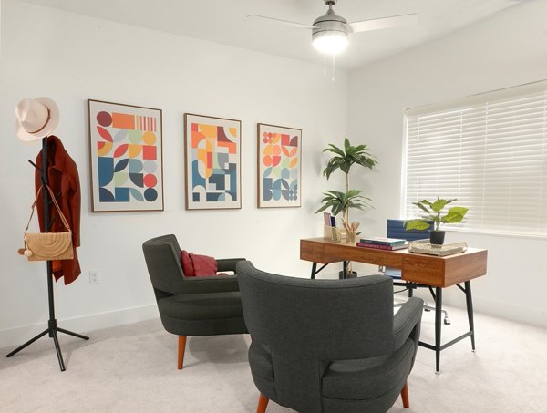 Cozy bedroom with elegant decor at Capriana Apartments offering luxury living