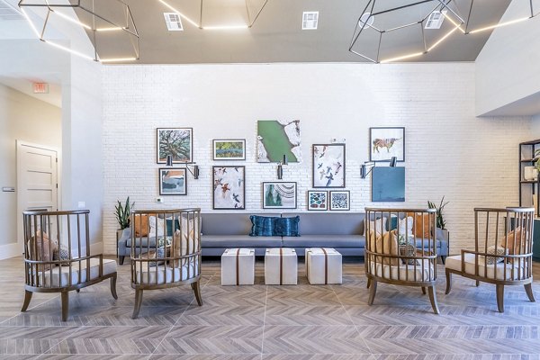 Clubhouse featuring modern design and comfortable seating at The Chloe Leander Apartments