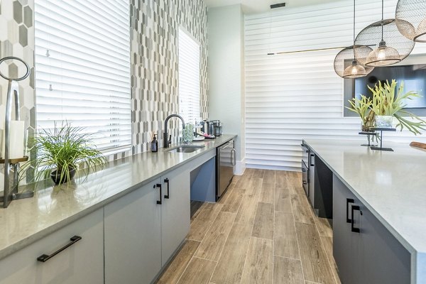 Modern clubhouse with stylish seating and ample natural light at The Chloe Leander Apartments