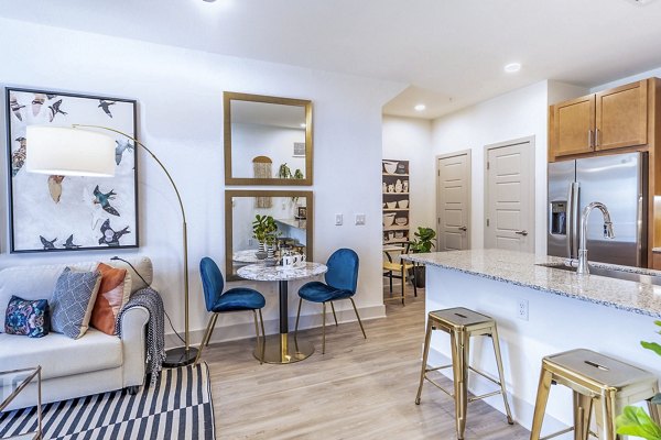 Dining room featuring elegant decor and modern lighting at The Chloe Leander Apartments, luxury living in an upscale community