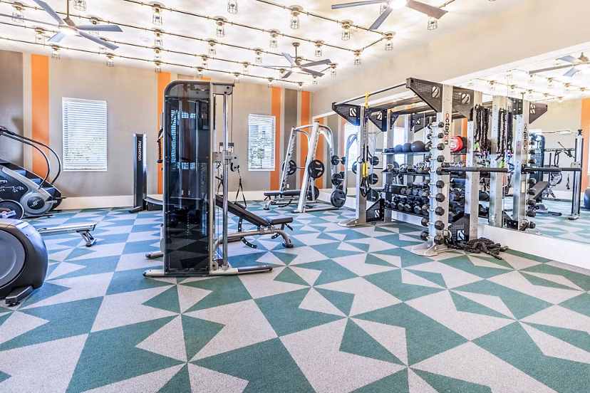 State-of-the-art fitness center with modern equipment at The Chloe Leander Apartments for luxury living