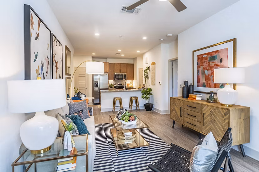 Chic living room with modern furnishings at The Chloe Leander Apartments, offering luxury living in a sophisticated setting