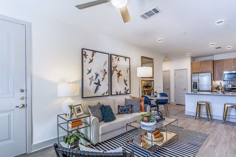 Spacious living room with modern decor at The Chloe Leander Apartments