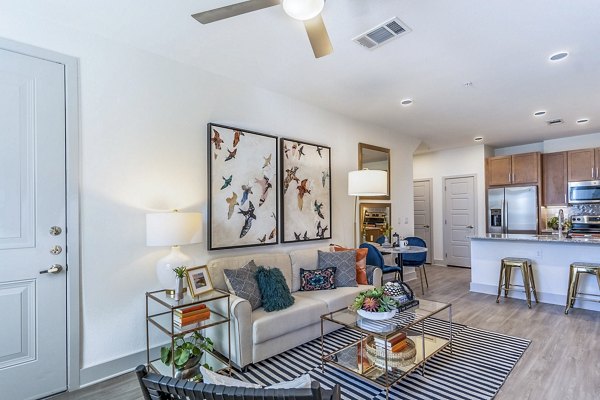 Spacious living room with modern decor at The Chloe Leander Apartments