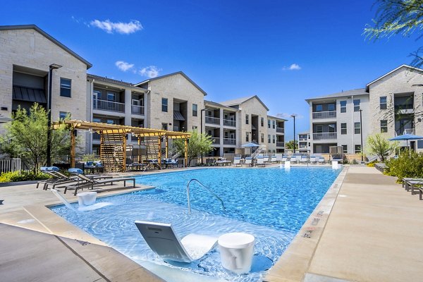 Resort-style pool with sundeck at The Chloe Leander Apartments