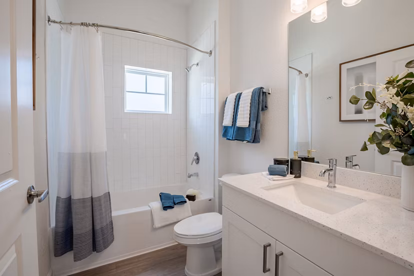 Bathroom featuring sleek fixtures and modern design at Eden Heritage Lakes Apartments
