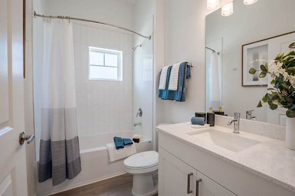 Bathroom featuring sleek fixtures and modern design at Eden Heritage Lakes Apartments