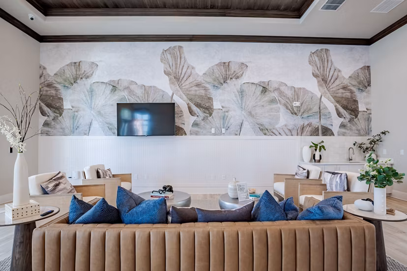 Clubhouse with elegant design and cozy seating at Eden Heritage Lakes Apartments
